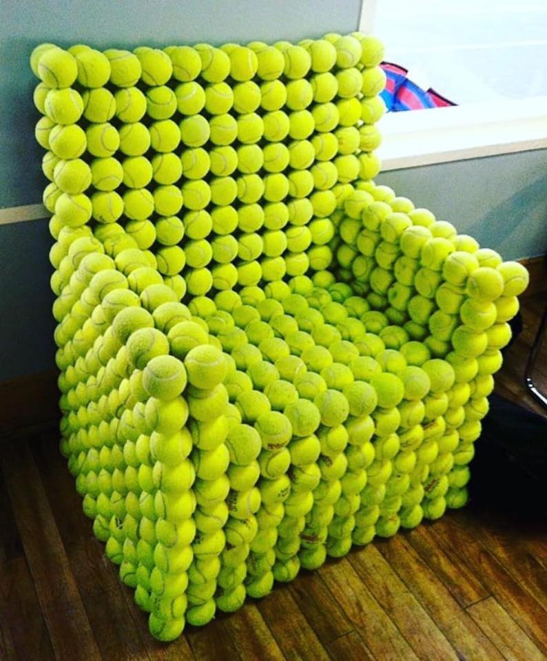 An armchair with balls of padel