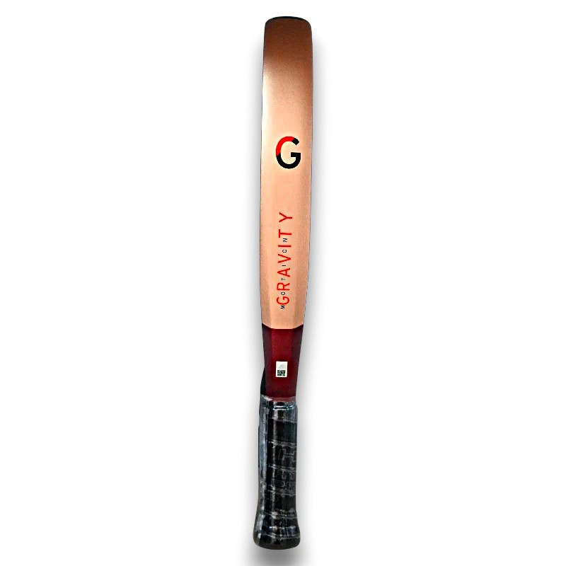 Vertical cricket bat with a copper-colored blade and dark wrapped handle, branded Gravity on a white background.