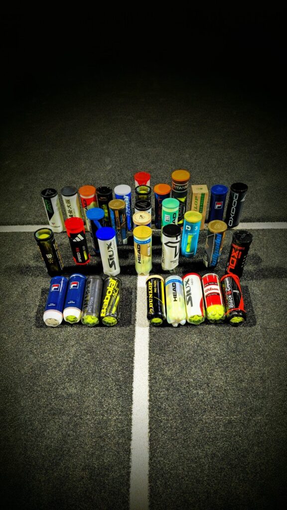 Famille 2 | Padel Magazine Assortment of energy gel tubes arranged in a cross shape on a dark asphalt track at night.