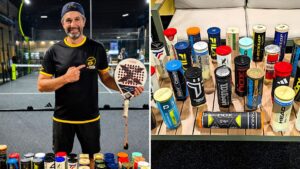 Man in black and yellow shirt holding a padel paddle on an indoor court, smiling at the camera.