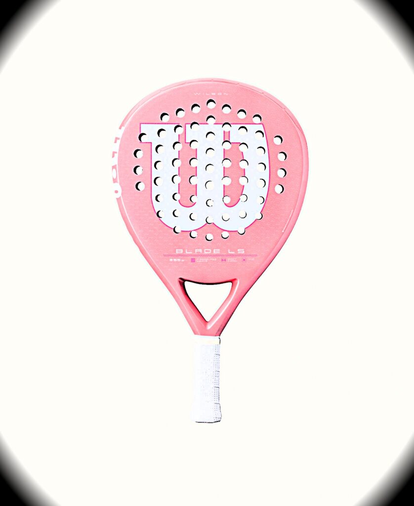 Blade LS Pink | Padel Magazine Pink padel racket with a perforated white surface and white grip, facing forward.