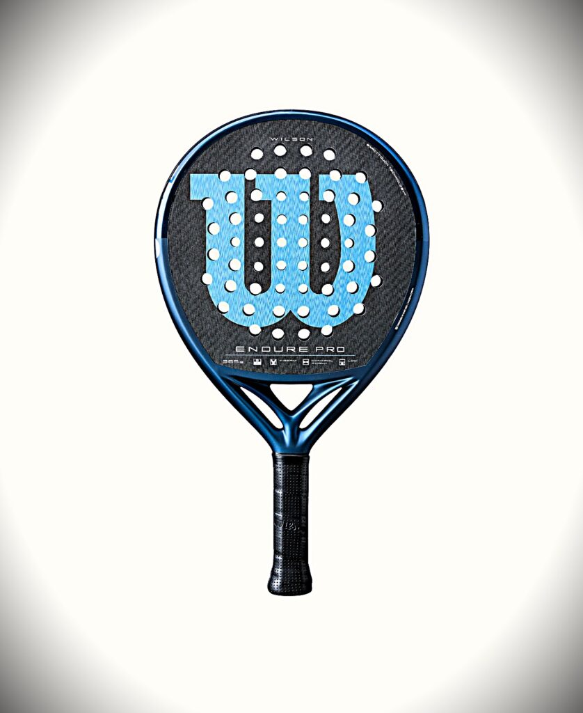 Close-up of a blue Wilson Endure Pro tennis racket head with circular string holes on a light backdrop