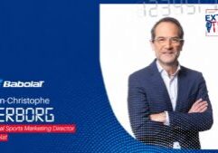 Jean-Christophe Verborg, Global Sports Marketing Director, on a blue Babolat promotional banner with logo and text.